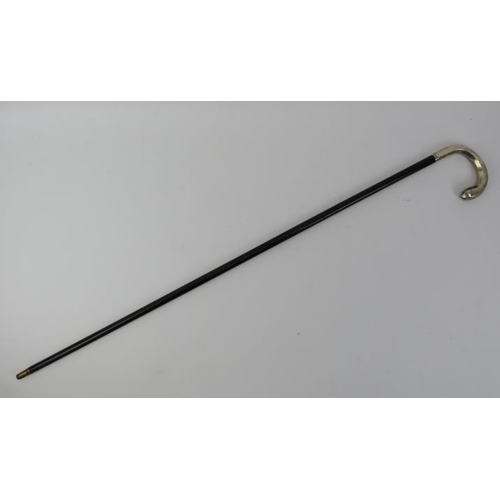 60 - An Edwardian ebonised walking cane with silver shepherd's crook handle. With a faceted handle, taper... 