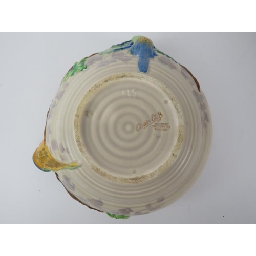 81 - A Clarice Cliff for Newport pottery bowl. Decorated in relief depicting brightly coloured parrots. I... 