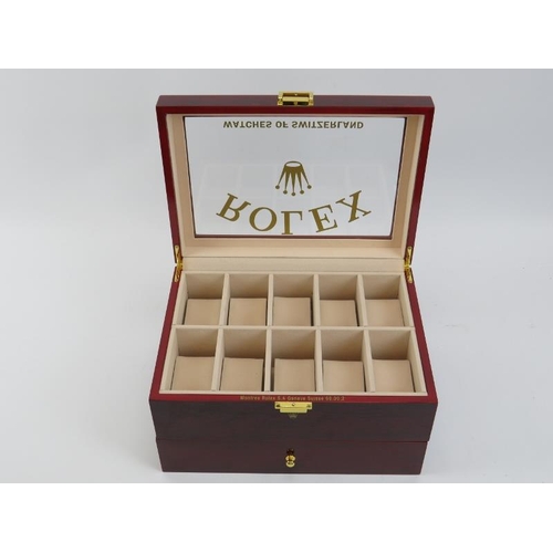 83 - A ‘Rolex Watches of Switzerland’ style presidential watch box. Compartmented for holding twenty watc... 