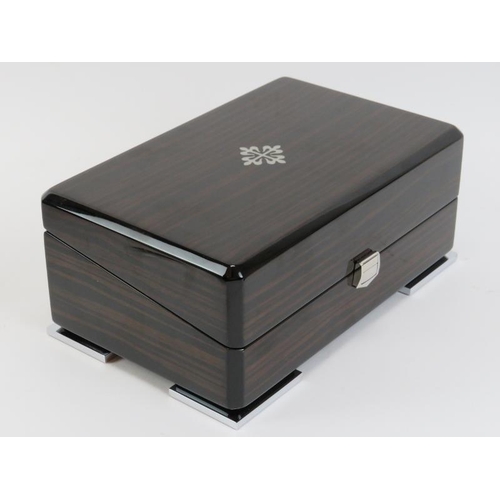 84 - A Patek Philippe wristwatch box. With fitted fabric lined interior, outer box and leather paperwork ... 