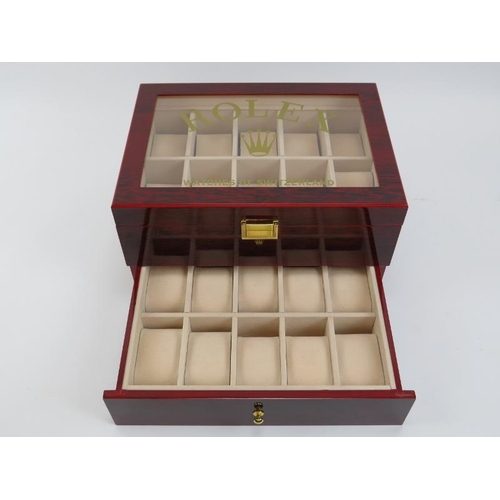 85 - A ‘Rolex Watches of Switzerland’ style presidential watch box. Compartmented for holding twenty watc... 