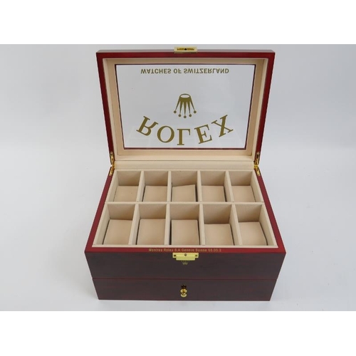 85 - A ‘Rolex Watches of Switzerland’ style presidential watch box. Compartmented for holding twenty watc... 