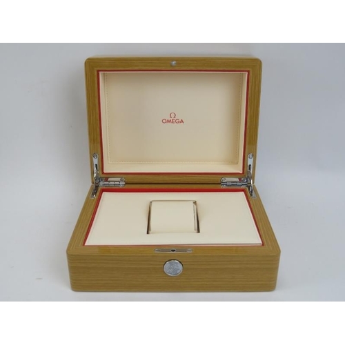 93 - An Omega wristwatch box. With a fitted lined fabric interior and outer card box. Outer box: 11.3 cm ... 