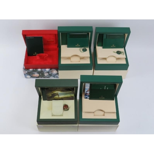 95 - Five Rolex wristwatch boxes. Comprising four green boxes and a red box. Some paperwork included (no ... 