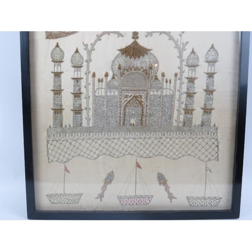 99 - A large late 19th Century Indian silk work in silver and gold thread, of the Taj Mahal below two pea... 