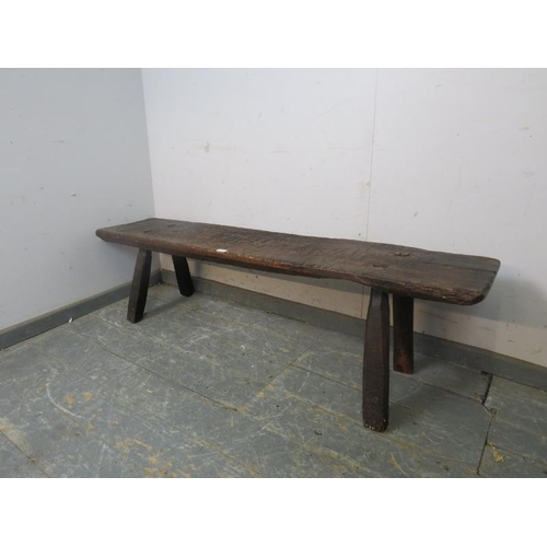 701 - A large 18th Century oak pig bench, on canted square supports.  Height 41cm x Width 158cm x Depth 44... 