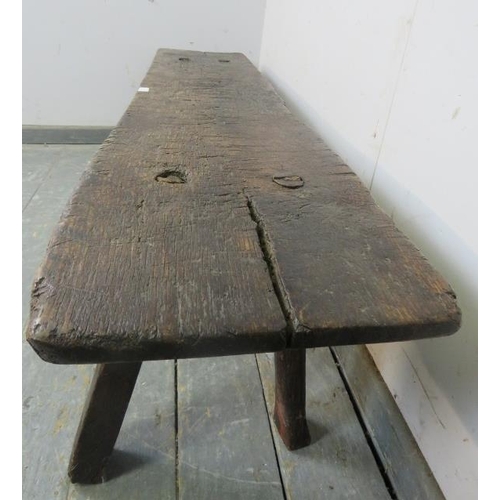 701 - A large 18th Century oak pig bench, on canted square supports.  Height 41cm x Width 158cm x Depth 44... 