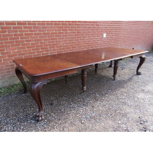 706 - A very large William IV mahogany banqueting table, having four additional leaves, on carved cabriole... 