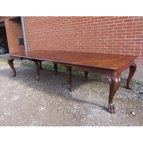 706 - A very large William IV mahogany banqueting table, having four additional leaves, on carved cabriole... 