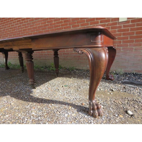 706 - A very large William IV mahogany banqueting table, having four additional leaves, on carved cabriole... 