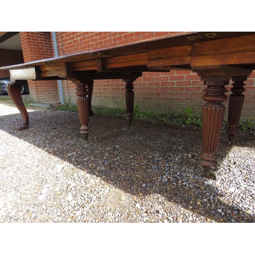 706 - A very large William IV mahogany banqueting table, having four additional leaves, on carved cabriole... 