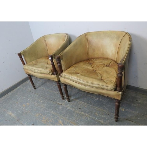 709 - A pair of vintage antique style mahogany tub chairs, upholstered in tan leather with brass studs, on... 