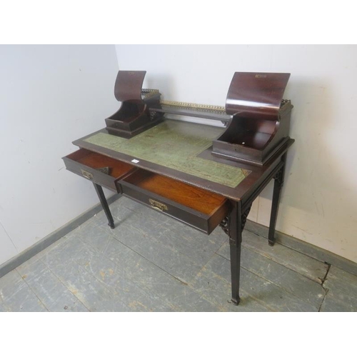 710 - A 19th century Aesthetic Movement ebonised writing desk by S.J. Waring, the upper gallery with open ... 