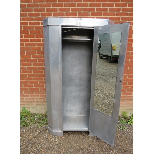 711 - An Art Deco Period aluminium double wardrobe with chamfered corners, the single door with butterscot... 