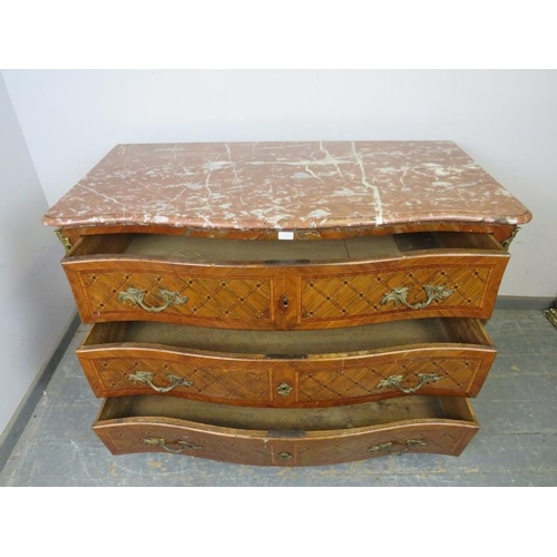 716 - A late 18th/early 19th century Louis XV style walnut serpentine commode chest, having a rouge marble... 