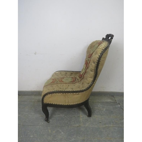 718 - A Napoleon III ebonised spoonback chair, retaining the original profusely buttoned upholstery with b... 