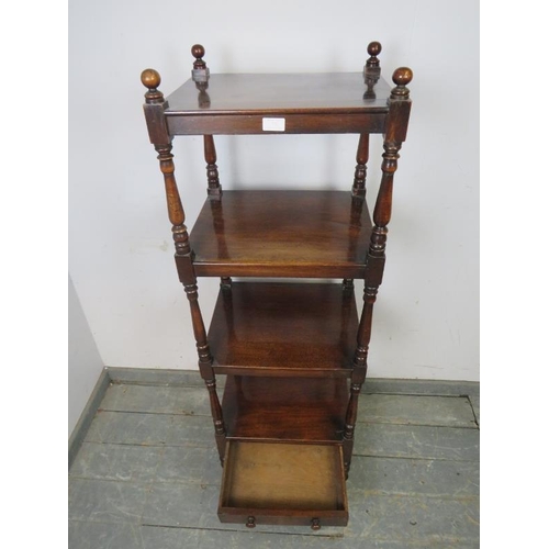 732 - A 19th Century mahogany freestanding four-tier whatnot, having turned ball finials and baluster upri... 