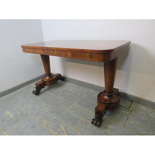 734 - A William IV rosewood library table, the tapering plain supports terminating on scrolled feet with e... 