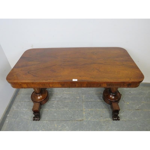 734 - A William IV rosewood library table, the tapering plain supports terminating on scrolled feet with e... 