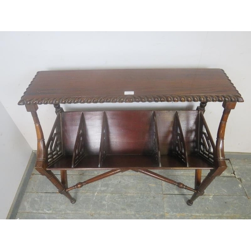 739 - An antique style mahogany book trough, having a gadrooned edge and five compartments with carved and... 