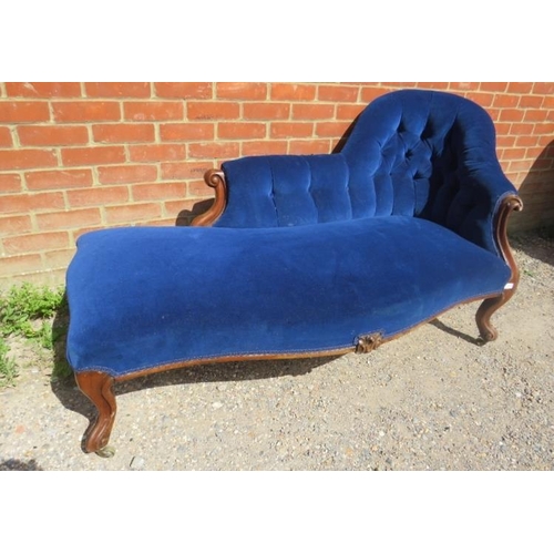 741 - A Victorian mahogany chaise longue, upholstered in buttoned royal blue velvet material, on ogee supp... 