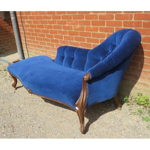 741 - A Victorian mahogany chaise longue, upholstered in buttoned royal blue velvet material, on ogee supp... 