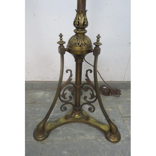 747 - An ornate Victorian gilt brass height adjustable standard lamp, having pierced acanthus leaf decorat... 