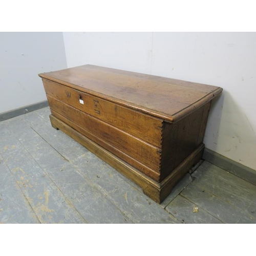 750 - A 19th century oak flat topped trunk of good colour, having internal candle box and retaining the or... 