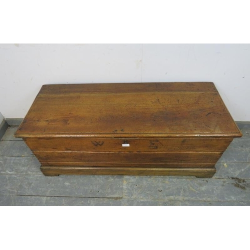 750 - A 19th century oak flat topped trunk of good colour, having internal candle box and retaining the or... 