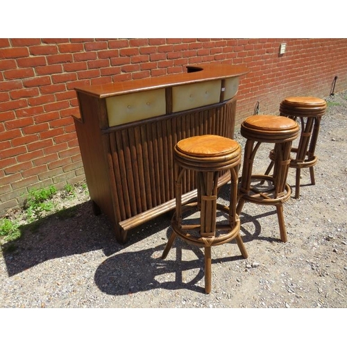 753 - A mid-century teak and bamboo corner bar, having open shelving, one short drawer and drinks cabinet ... 