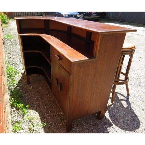 753 - A mid-century teak and bamboo corner bar, having open shelving, one short drawer and drinks cabinet ... 