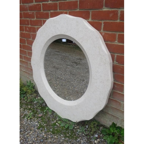 764 - A large circular bathroom mirror within marble effect composite shaped surround.  Diameter 100cm D4c... 