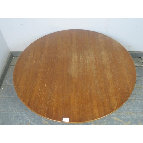 765 - A mid-century Scandinavian circular teak coffee table by Folke Olsson, on turned supports with brass... 