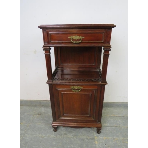 773 - An Edwardian mahogany side cabinet, having one long drawer above an open shelf with reeded Ionic col... 