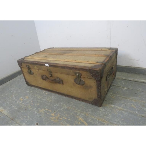 775 - An early 20th century steamer trunk by M. Wurzl & Sohne, having leather mounts and brass fittings, t... 