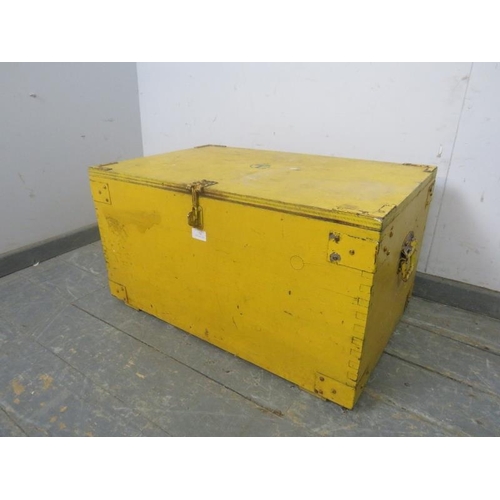 776 - A vintage Telecom flat top trunk painted yellow, having internal candle box, hasp & staple catch and... 