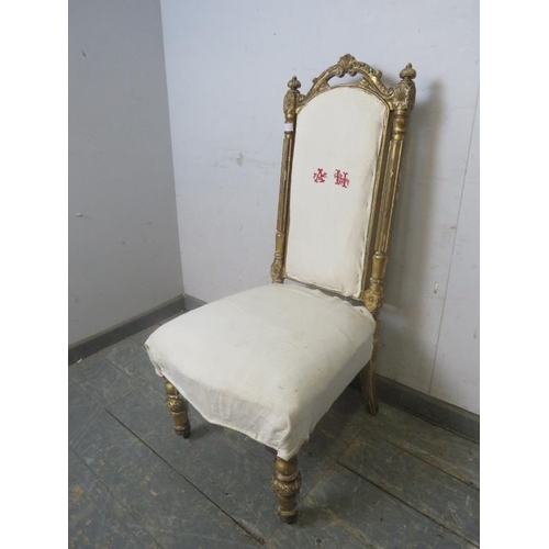 778 - A 19th century French giltwood bedroom chair, the carved cornice and bun finials above reeded uprigh... 