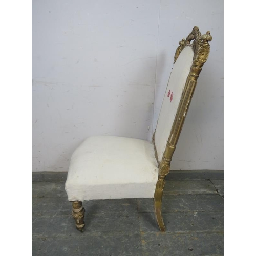 778 - A 19th century French giltwood bedroom chair, the carved cornice and bun finials above reeded uprigh... 