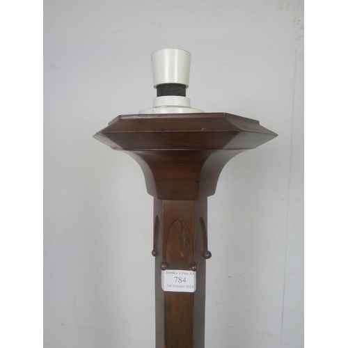 784 - An early 20th century walnut hexagonal standard lamp in the Gothic taste, on a stepped plinth base. ... 