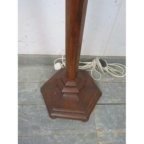 784 - An early 20th century walnut hexagonal standard lamp in the Gothic taste, on a stepped plinth base. ... 