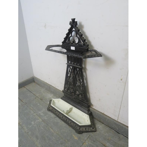 785 - An Aesthetic Movement cast iron stick stand in the manner of Thomas Jekyll, having pierced trefoil d... 