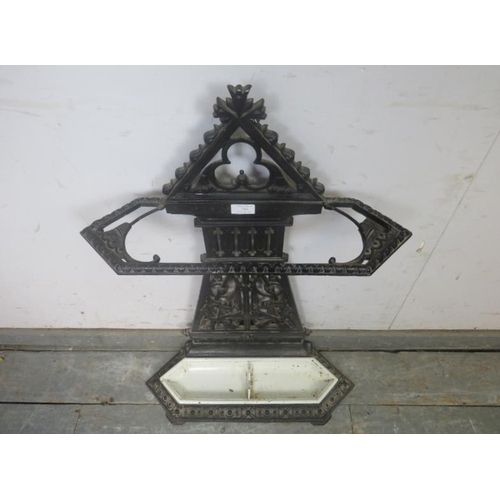 785 - An Aesthetic Movement cast iron stick stand in the manner of Thomas Jekyll, having pierced trefoil d... 