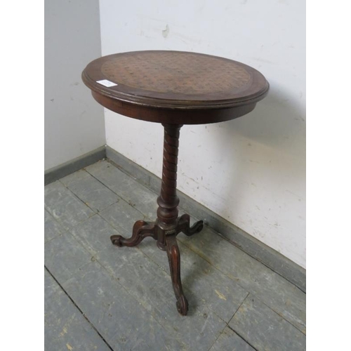 796 - A Victorian walnut wine table, the top with profuse parquetry inlay, on a spiral carved column with ... 