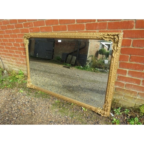 801 - A large 19th century bevelled rectangular wall mirror, within an ornately moulded gilt gesso frame. ... 