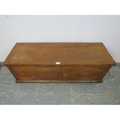 803 - A 19th century elm flat topped trunk of good colour, on stile supports. 
H43cm W106cm D36cm (approx)... 