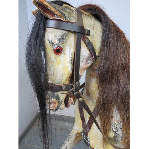 804 - A Victorian carved 48” rocking horse, retaining the original paintwork and with real horsehair mane ... 