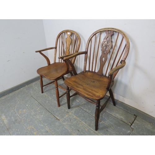 814 - A matched pair of 19th century elm and fruitwood elbow chairs, one a wheelback, the other with shape... 