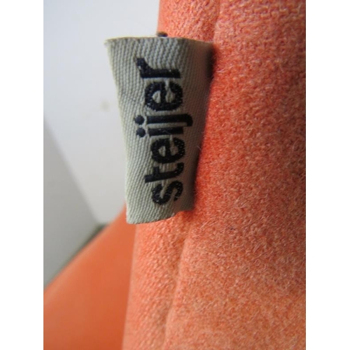 817 - A contemporary swivel and reclining ‘egg’ lounge chair by Steijer, covered in salmon pink fabric, on... 