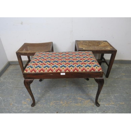 819 - An antique mahogany duet stool, recovered in multicoloured woollen material, on cabriole supports. T... 