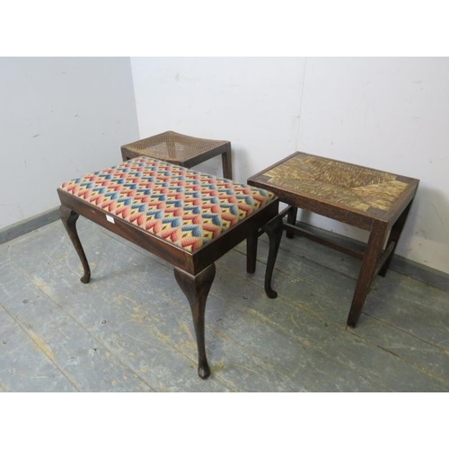 819 - An antique mahogany duet stool, recovered in multicoloured woollen material, on cabriole supports. T... 